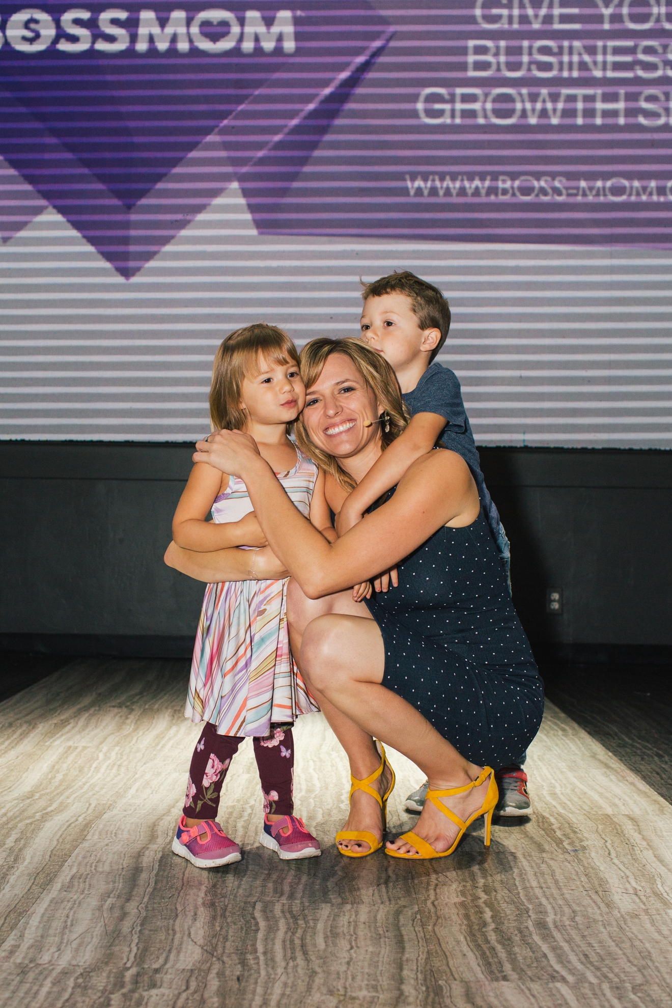 Dana Malstaff with her kids on the BossMom stage