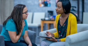 how to overcome perfectionism. two women talking.